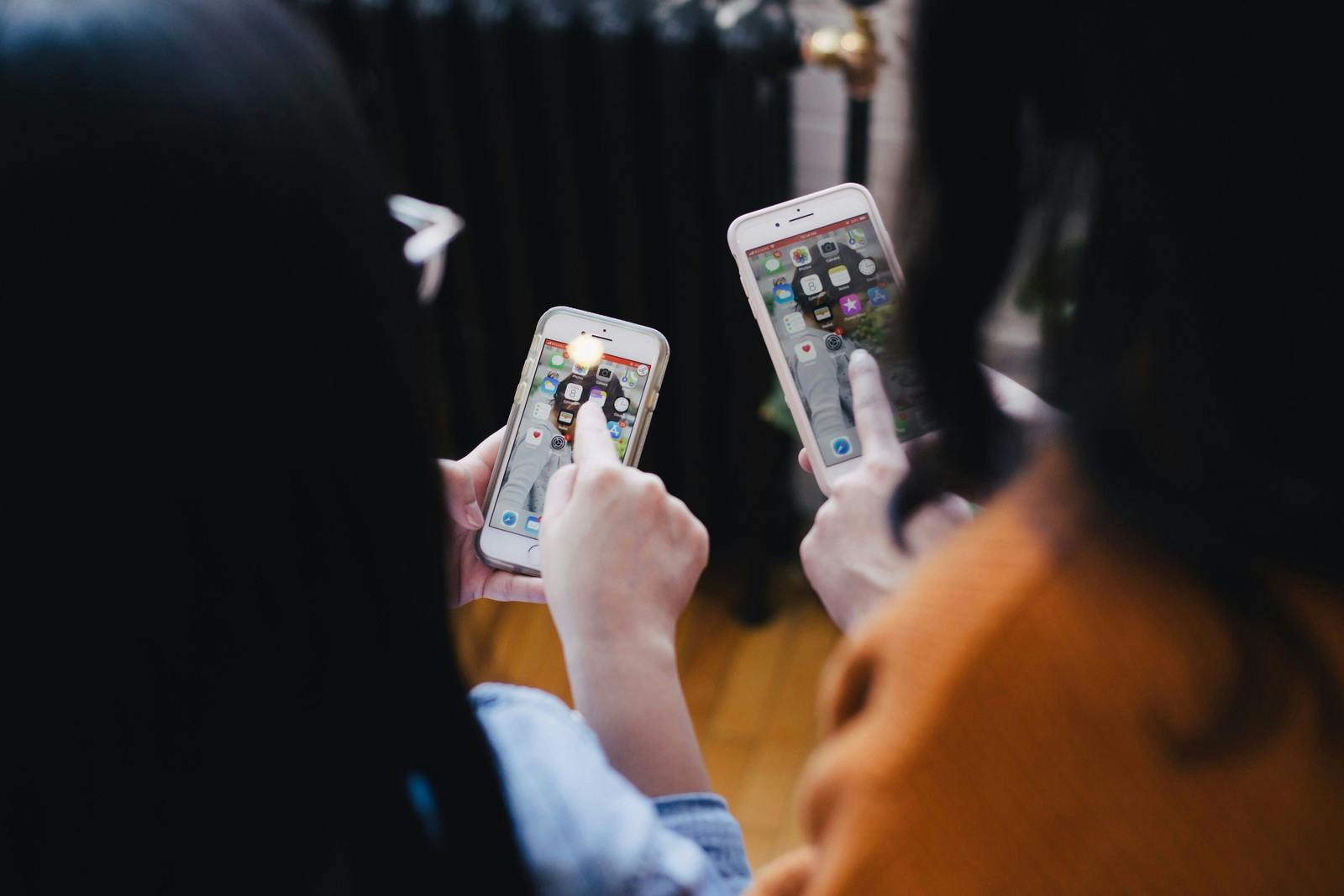 Two persons with mobile phones