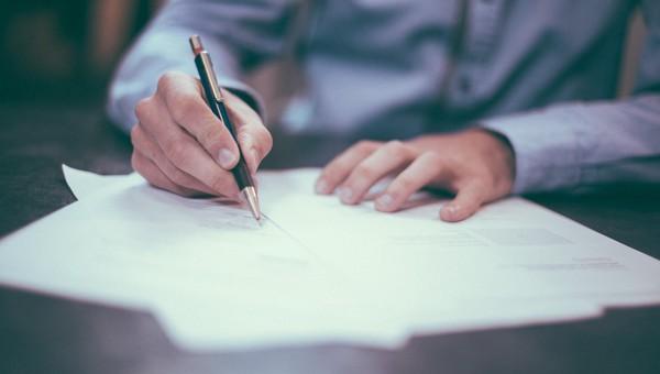 Person signing an agreement